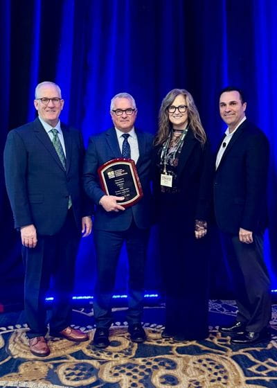 Dan Schurr receives the 2026 Farmer Cooperative Director of the Year award from the National Council of Farmer Cooperatives (NCFC). From left, Kevin Brinkley, NCFC chair, Dan Schurr, Karen Schurr and Duane Simpson, NCFC president and CEO. 