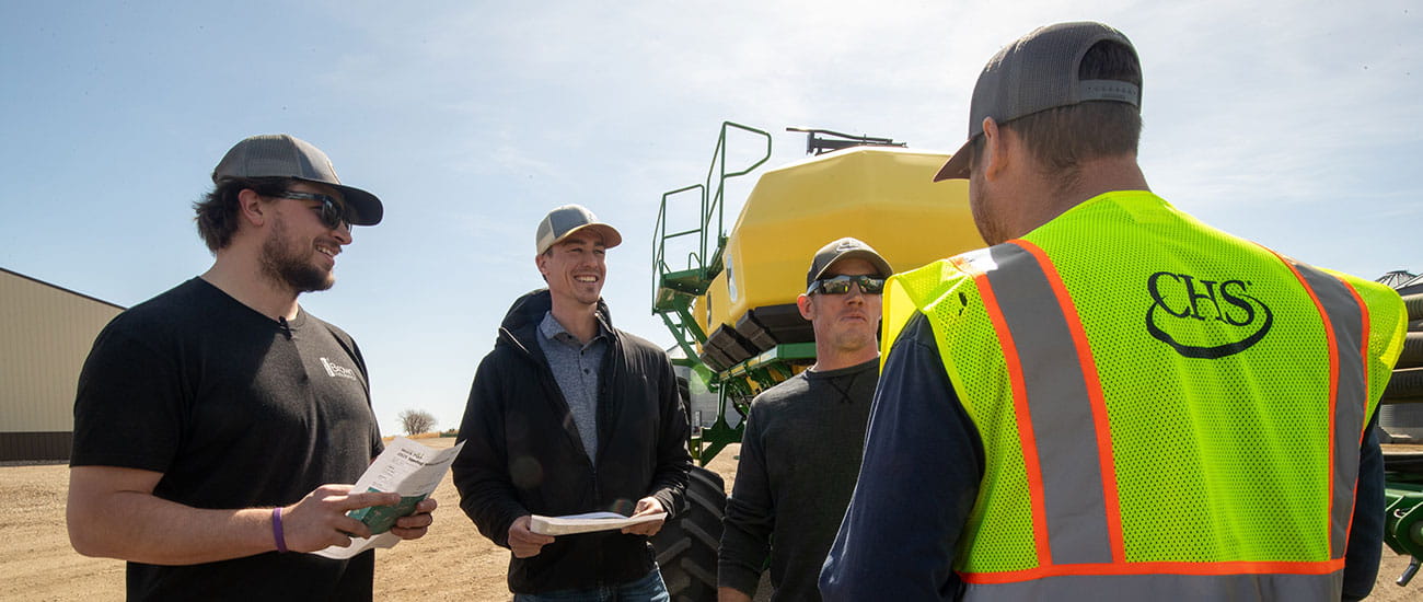 Talking in front of a sprayer