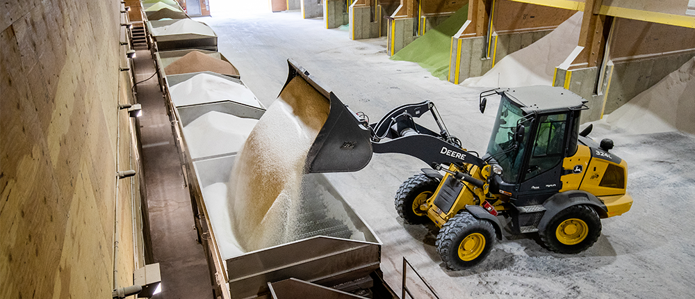 A bulldozer loading urea in a warehouse in Galveston, Tx.